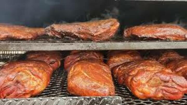 Logo for Holy Smoke BBQ