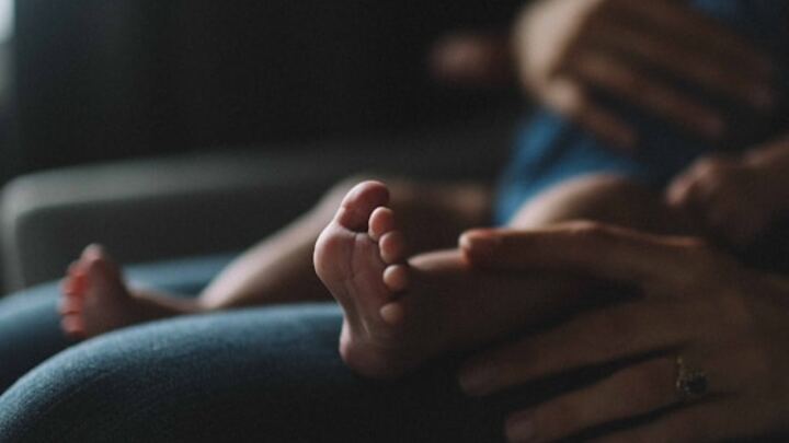 Logo for The Motherhood Collective