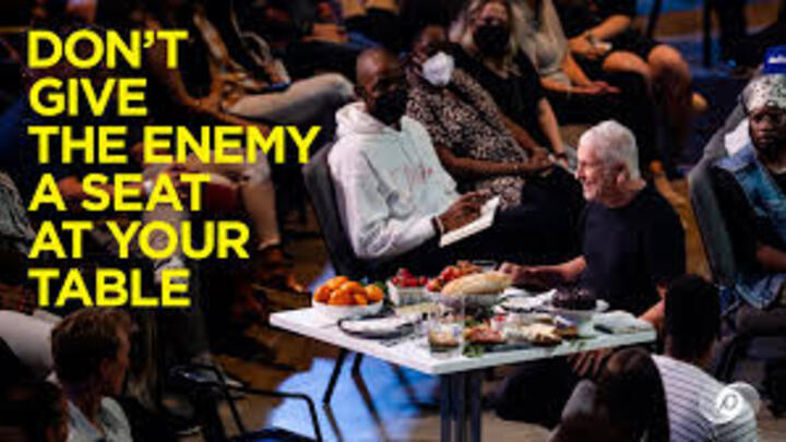 Logo for Don't Give The Enemy A Seat At Your Table
