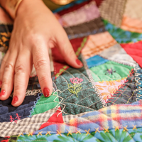 Logo for Caring Like Christ Quilting Group